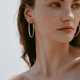 Sculptural white C-hoop statement earrings in 925 sterling silver