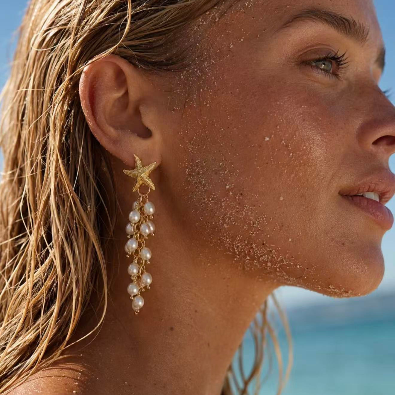 Starfish freshwater pearl tassel earring worn by the sea