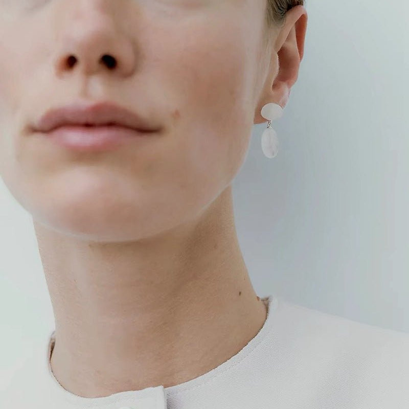 Silver white jade drop earrings styled on a model
