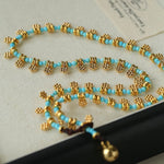 Mini Faceted Turquoise Bead Necklace with Gold Flower Pendant - floysun