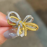 Two-tone brushed bow statement ring in sterling silver