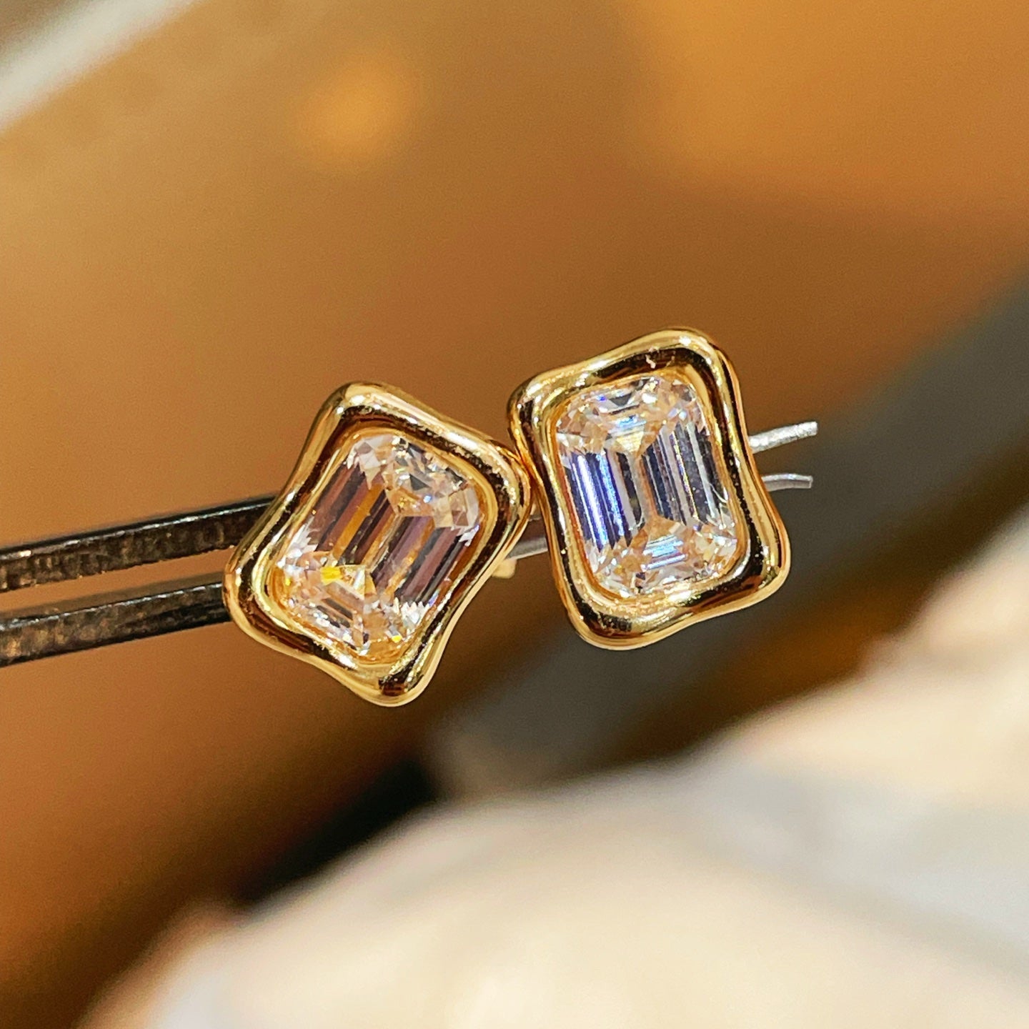 Clear rectangular step-cut diamond simulant stud earrings