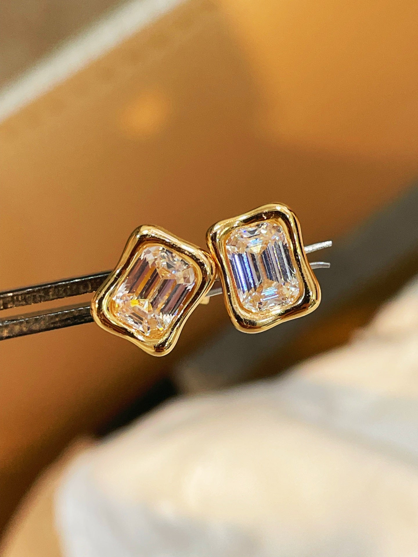 Clear rectangular step-cut diamond simulant stud earrings