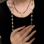 Natural stone square pendant necklace layered with pearl jewellery