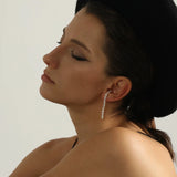 Graduated Pearl Linear Earrings