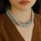 Elegance in Layers：Triple-Layer Gray Pearl Necklace
