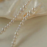 Graduated Pearl Linear Earrings